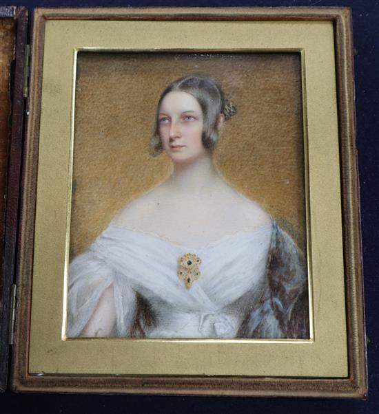 A Victorian oil on ivory miniature of a young lady, 11 x 9cm, leather cased